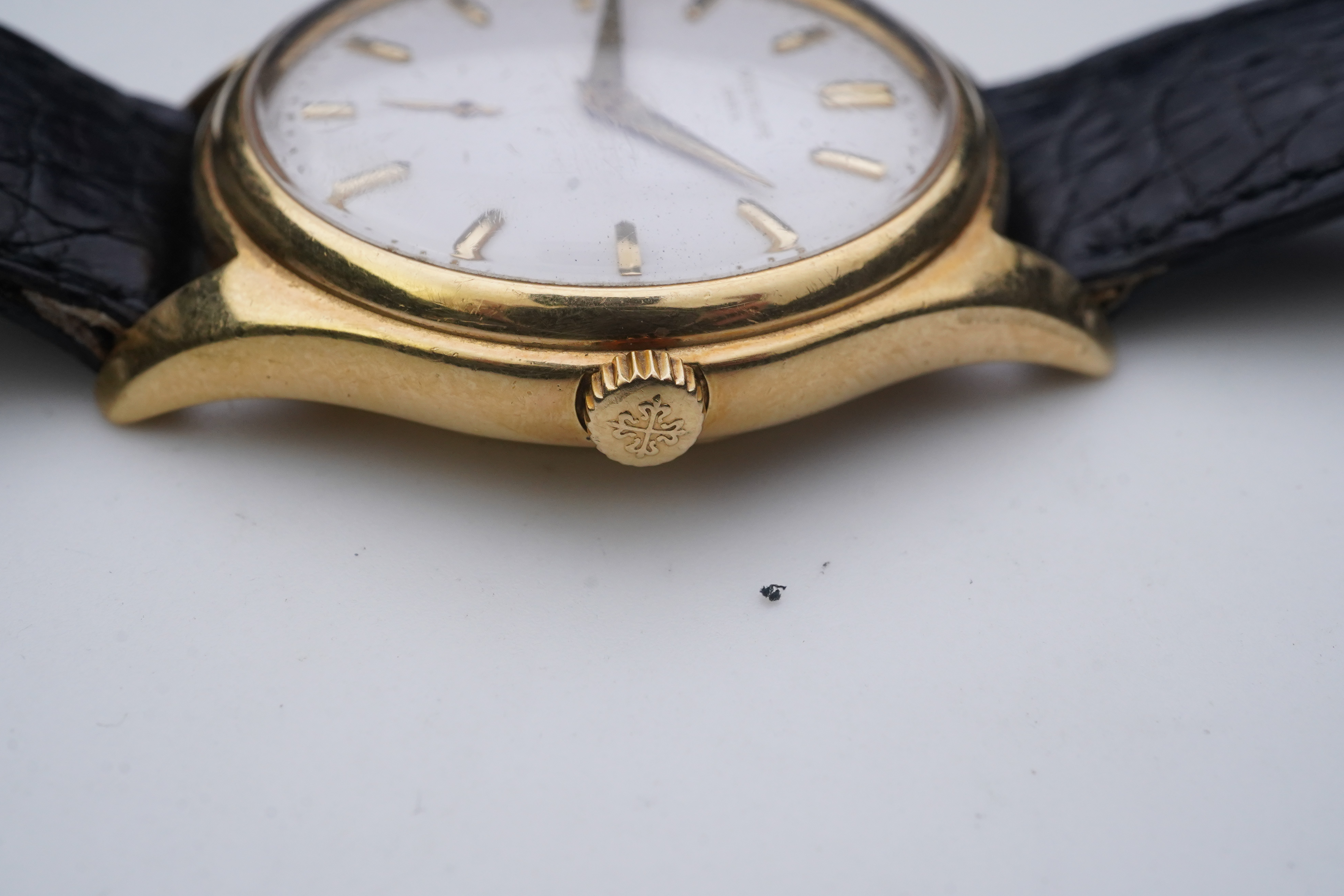 A gentleman's fine 18ct gold Patek Philippe Calatrava automatic wrist watch, model number 2526, on a Patek Philippe black leather strap with a Patek Philippe 18ct gold buckle